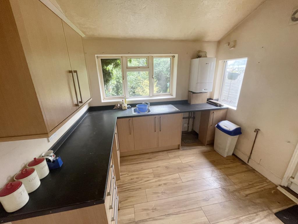 Lot: 5 - TWO-BEDROOM TERRACE HOUSE FOR IMPROVEMENT - kitchen area